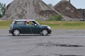 This passenger has to reach out of the window but is not at a disadvantage because his car has a hard top.